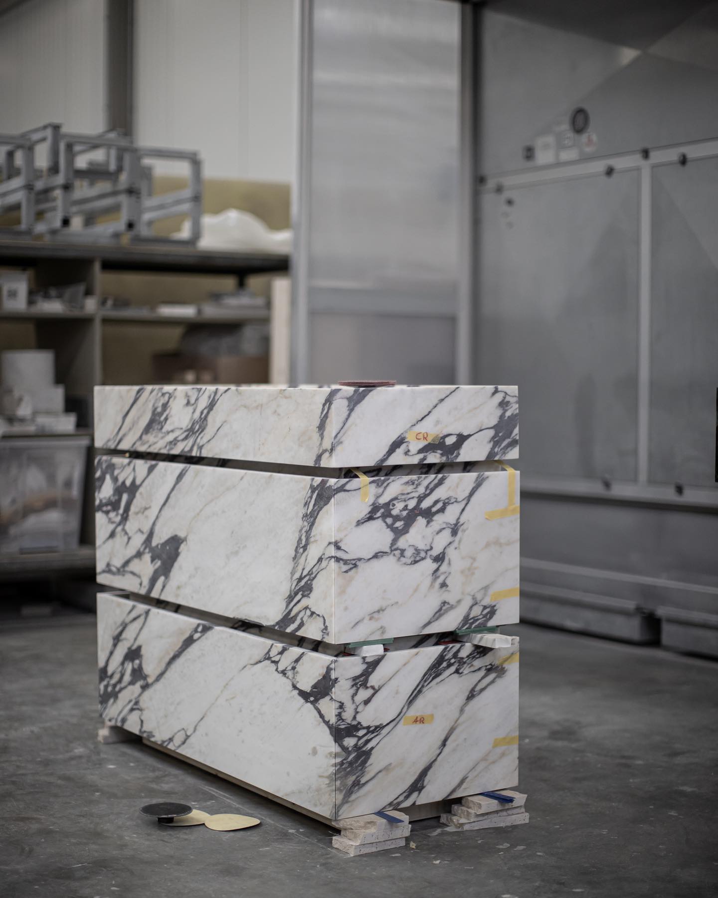 Venice marble vanity in Calacatta Gold in workshop showing stone fabrication and craftsmanship process