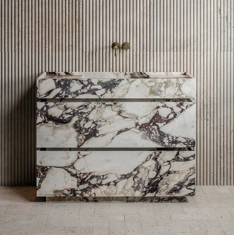 Venice marble vanity in Calacatta Viola natural stone with integrated basin in a refined architectural bathroom setting