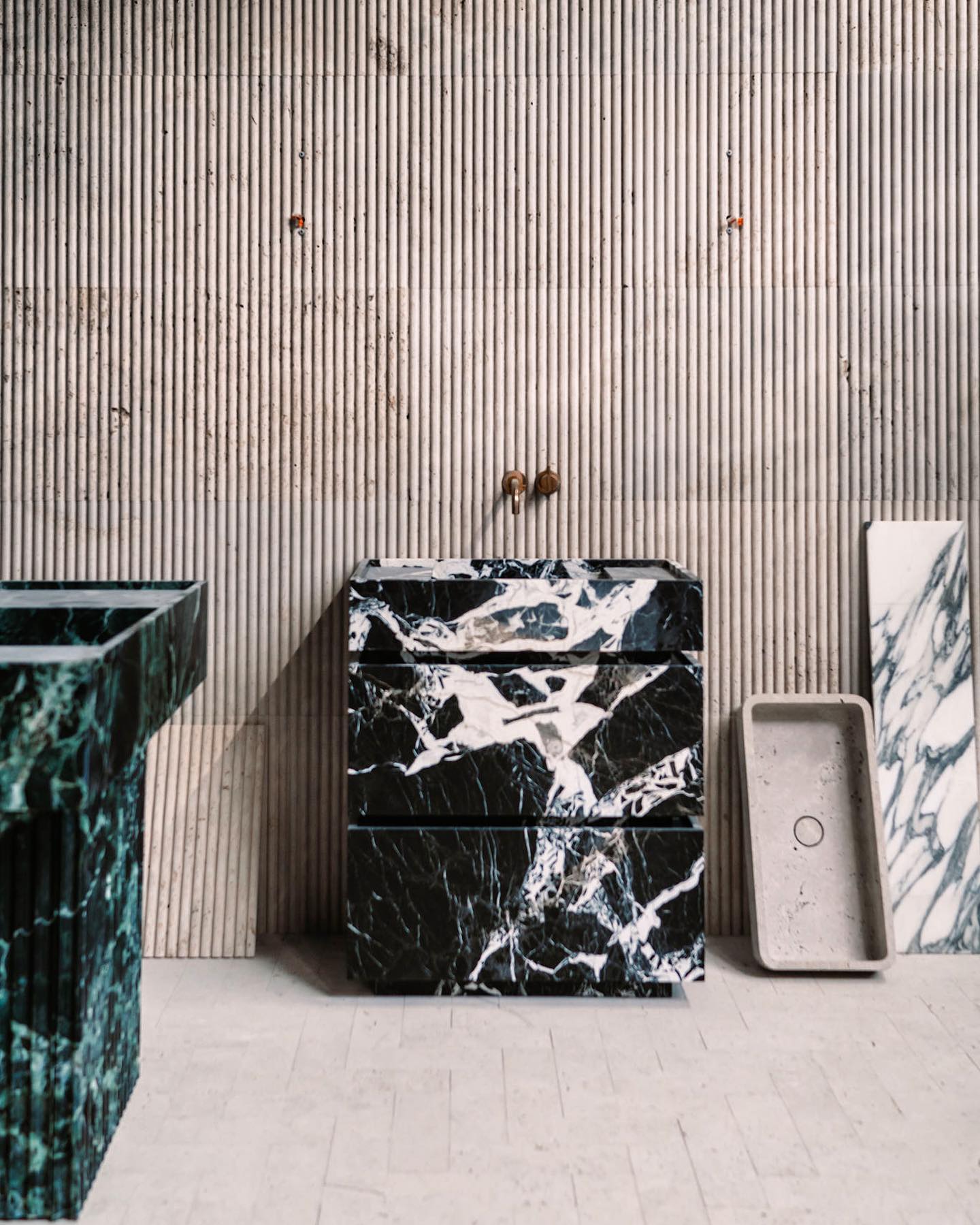 Venice marble vanity collection showing different natural stone variations including black and green marble designs