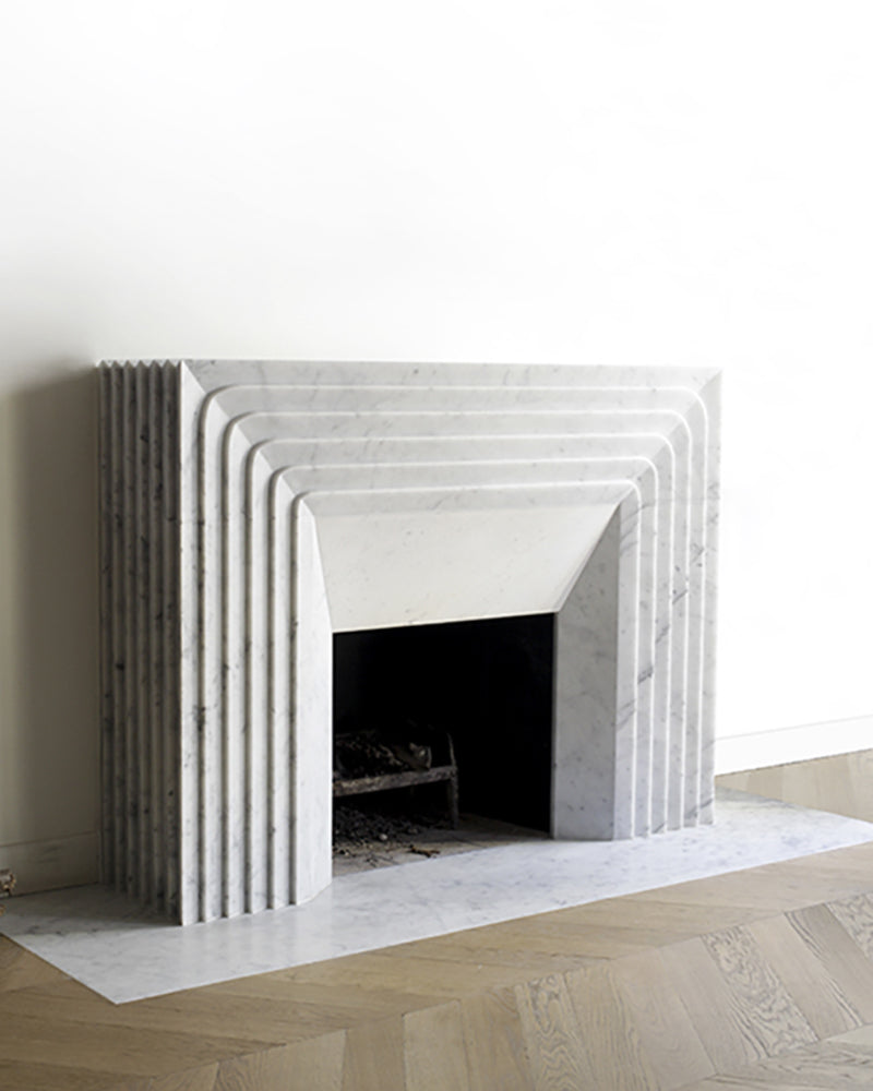 Verona Carrara marble fireplace with sculptural stepped surround