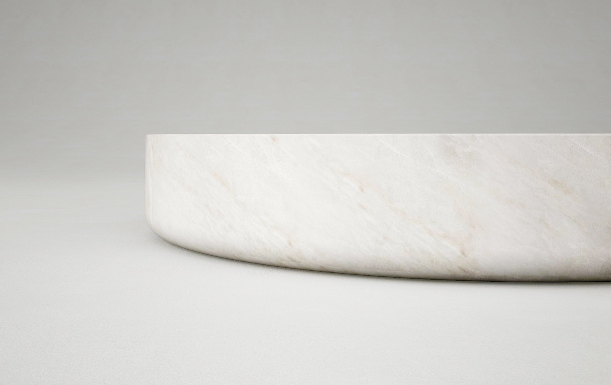 Vicenza round travertine coffee table sculptural edge natural stone Eden Stone Designs